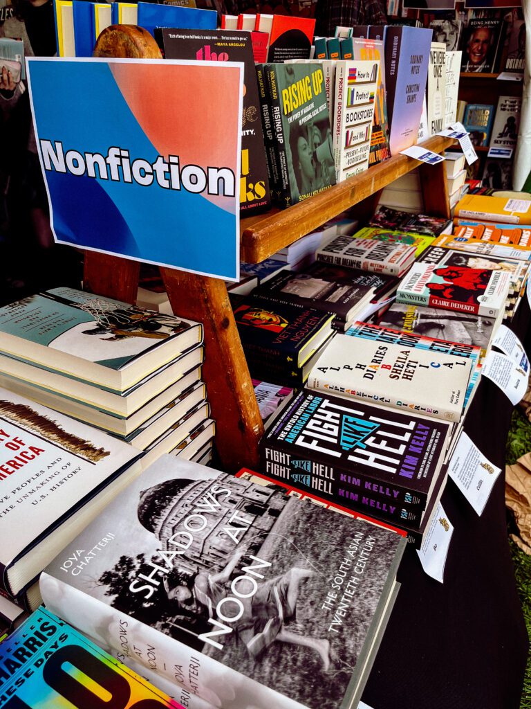 Shelves filled with nonfiction books for sale