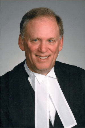 Kumar Murty standing with calculation in the background behind him.