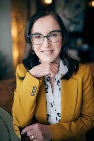 Kumar Murty standing with calculation in the background behind him.