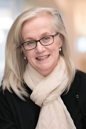 Kumar Murty standing with calculation in the background behind him.